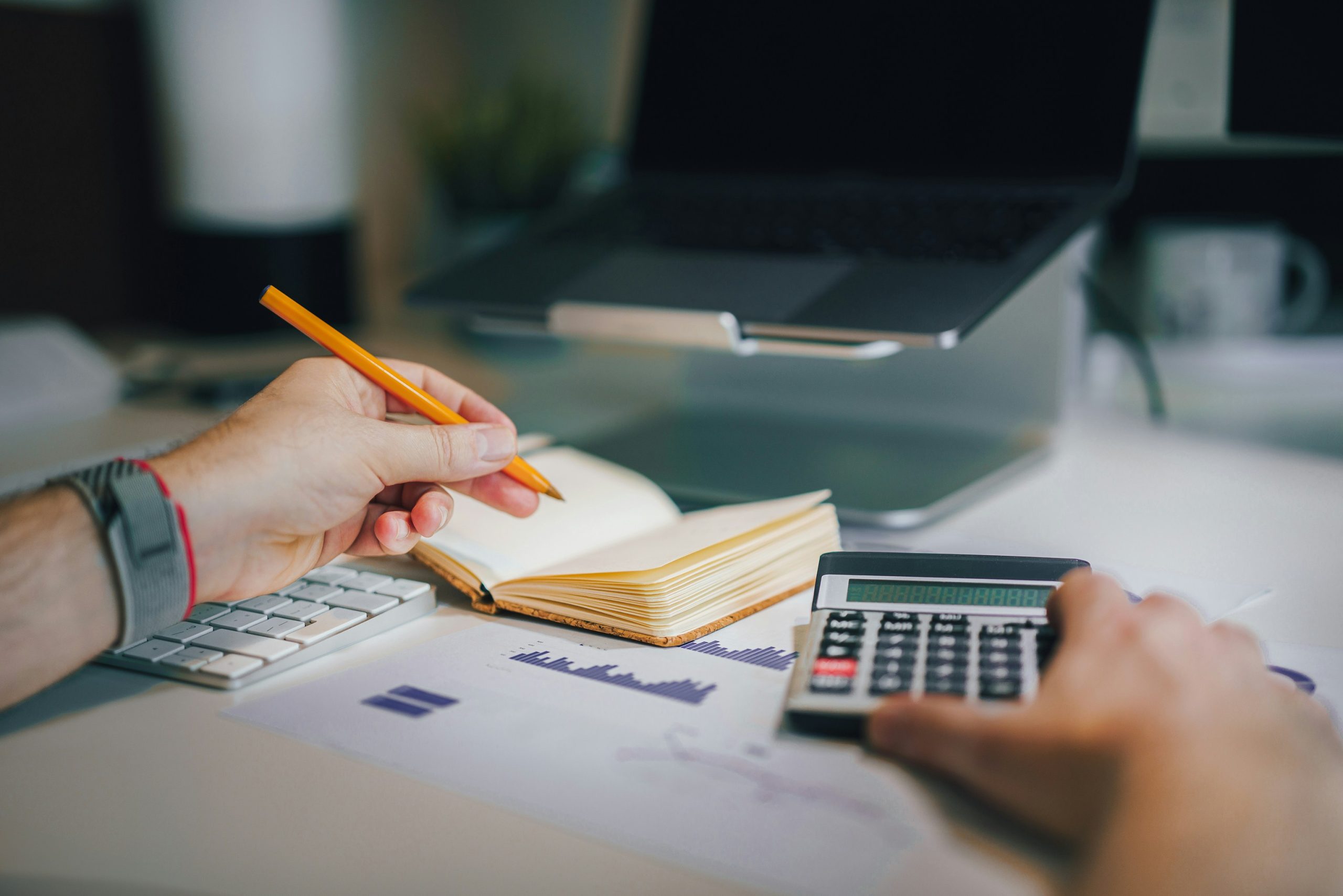 Person balances books, a method of cash basis accounting in cash vs. accrual accounting