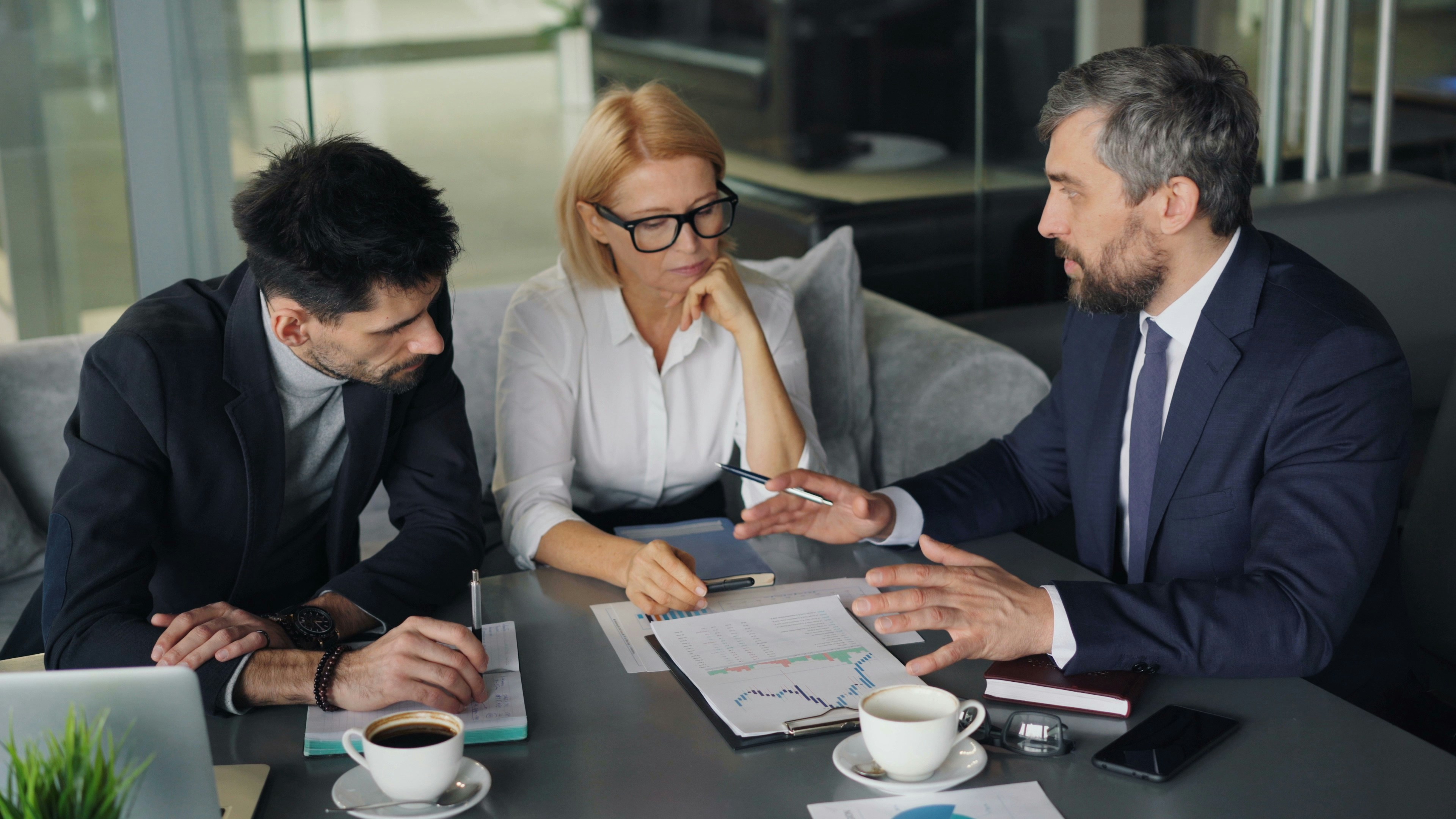 Business leaders meet with outsourced accounting firm