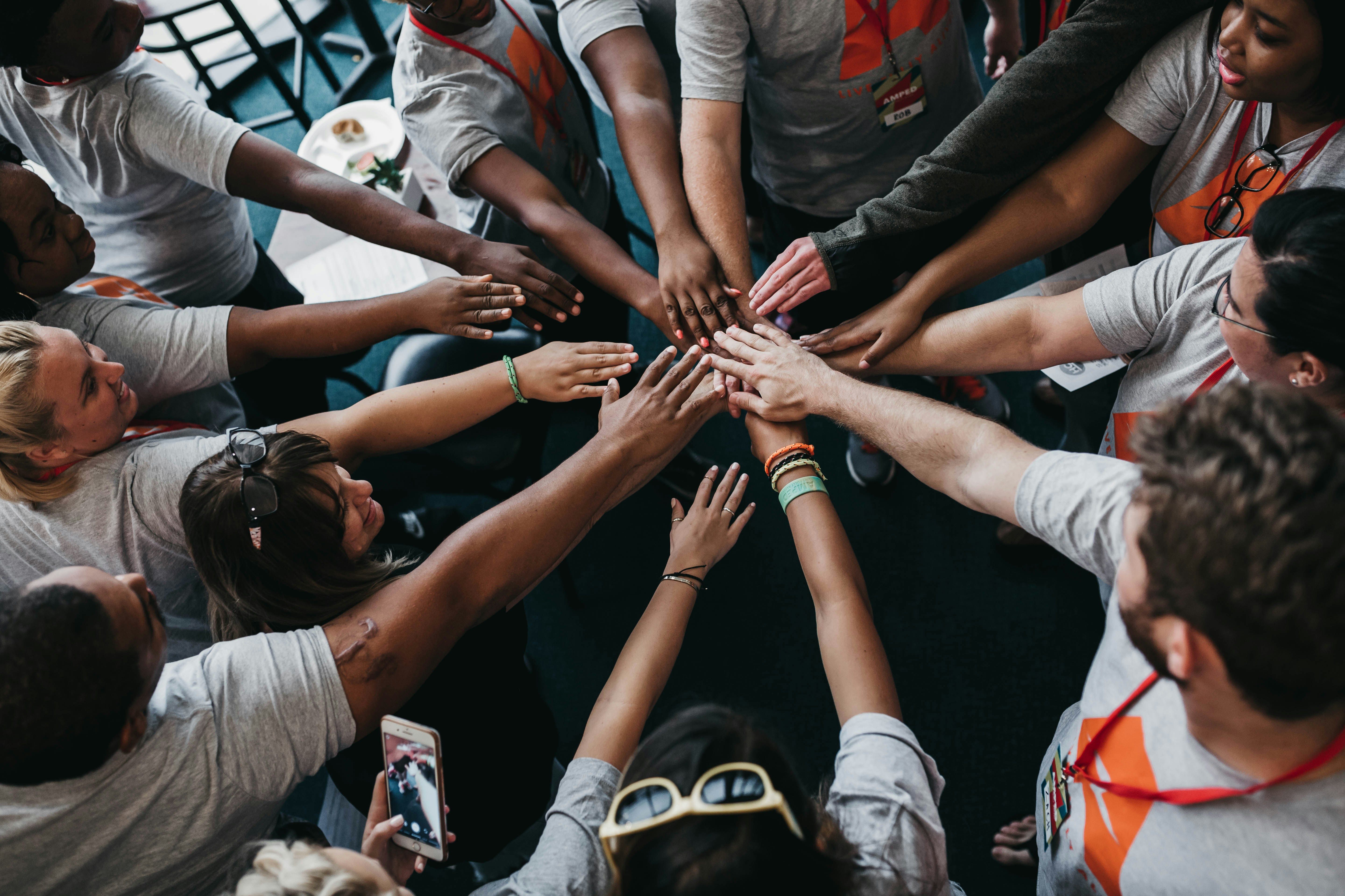 Hands in the middle to illustrate nonprofit and nonprofit grant accounting