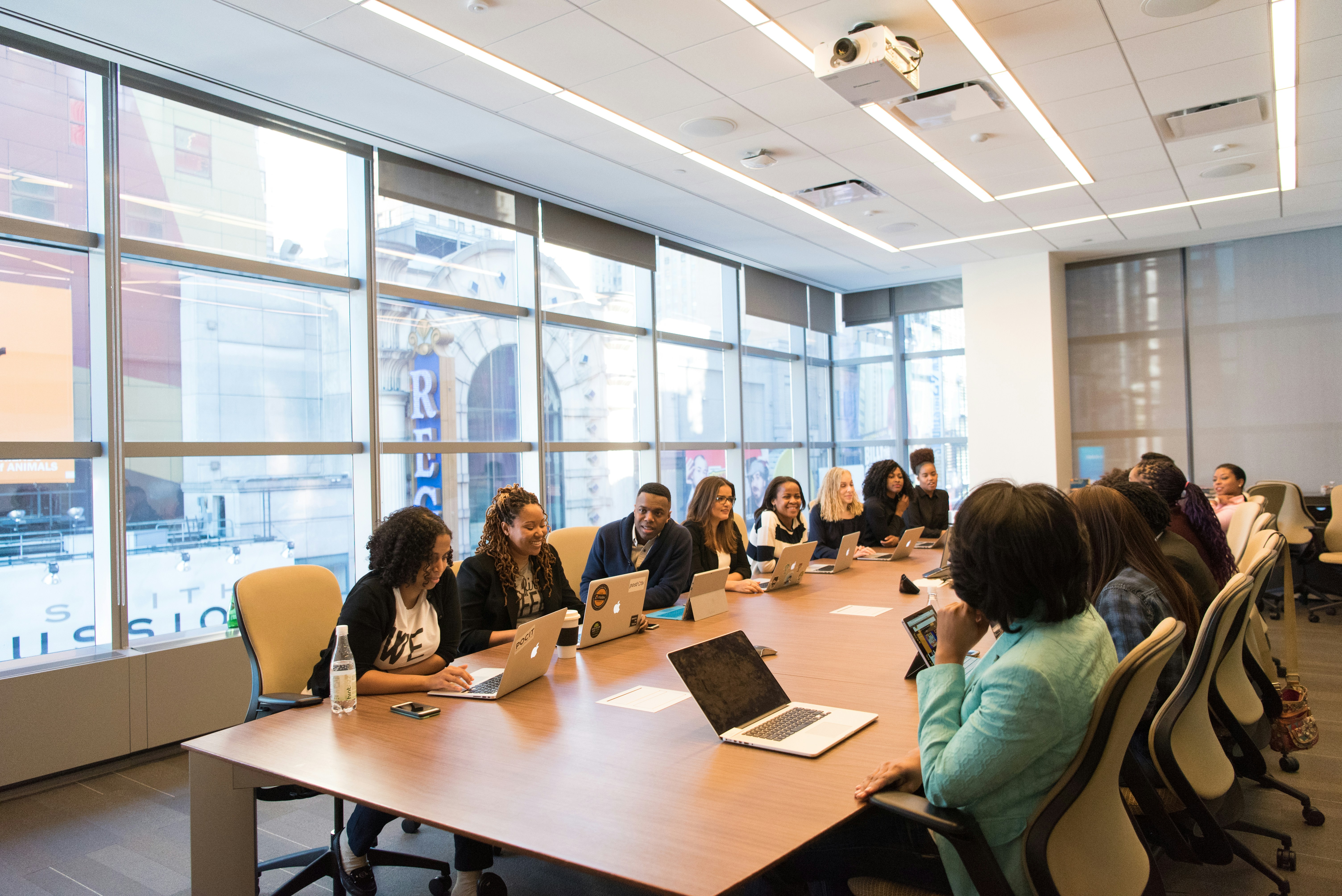 Nonprofit executive director sits at a table with staff members.